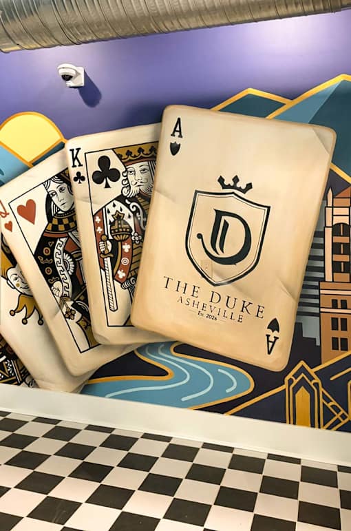 A deck of cards with a playing card showing the Ace of Diamonds.