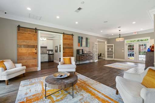 A living room with a white couch and a coffee table.