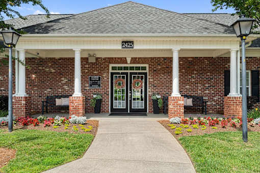 A building with a black door and a sign that says 2425.