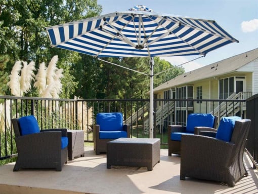 Sundeck with chairs and umbrellas  at Huntington Apartments, North Carolina, 27560