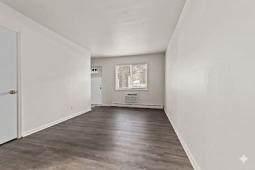 A room with a door and a window.
