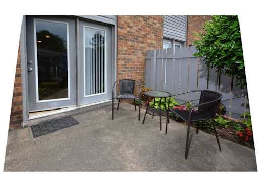 A patio with a table and chairs is shown.