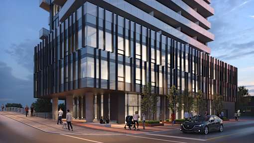 A modern building with a glass facade is depicted in the image.