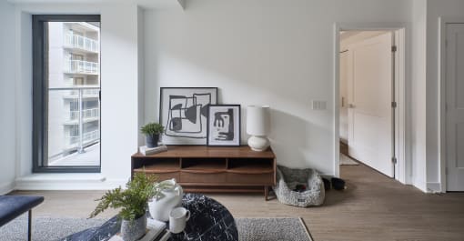 a living room with a couch and a table and a window