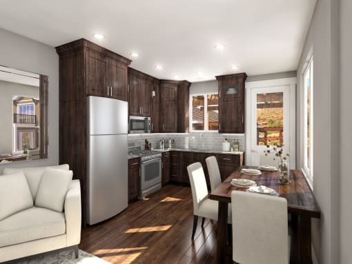 Kitchen With Dark Wood Cabinetry, Sleek Appliances, and Dining Area at Moenave Townhomes in Springdale, Utah