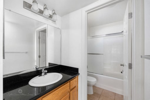 Bathroom with white interiors at Lotus Villas, Bakersfield