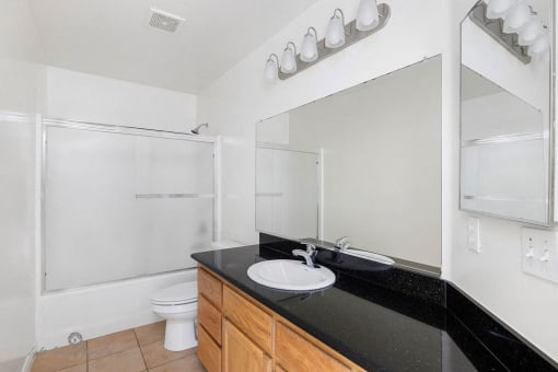 Bathroom with Basin and mirror at Lotus Villas, California, 93312