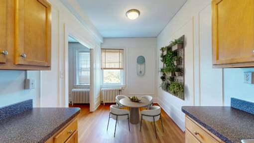 A kitchen with wooden cabinets and granite countertops.