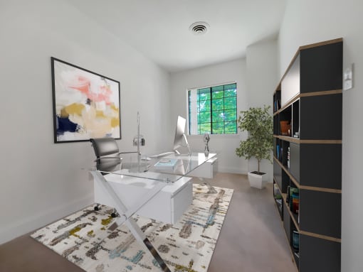 an office with a white desk and a painting on the wall