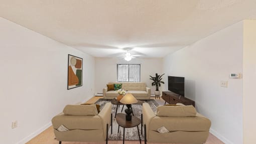 a living room with couches and a tv
