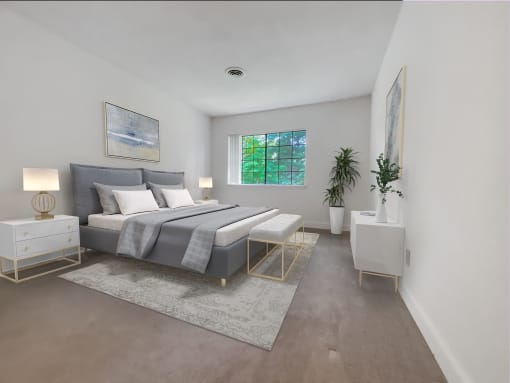 a bedroom with white walls and a gray bed