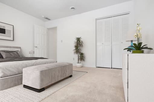a white bedroom with a bed and a white dresser