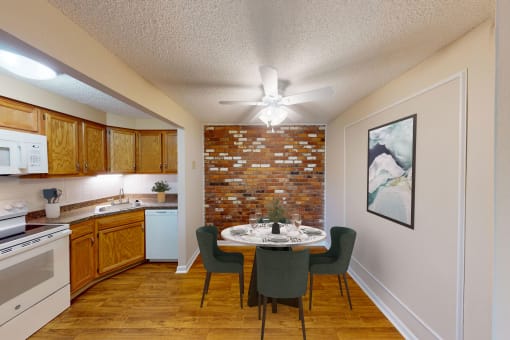 a kitchen and dining room with a table and a ceiling fan
