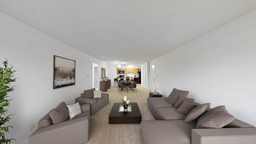 A long hallway with a row of couches on either side.
