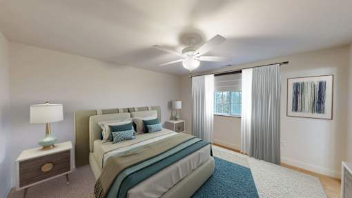 A bedroom with a bed, nightstand, and window.