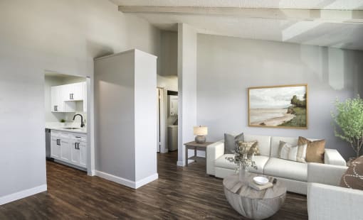 a living room with a white couch and a table