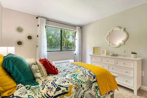 Expansive bedroom with room for a queen-size bed, additional furniture, and large closets.