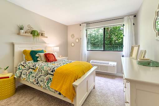 Expansive bedroom offering flexible furniture space and large closets.