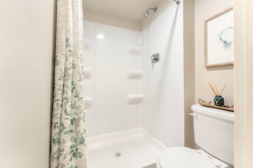 Full-sized walk-in fiberglass showers.