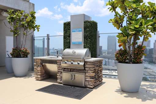 Grill out with endless city views on top of our Sky Deck rooftop amenity.