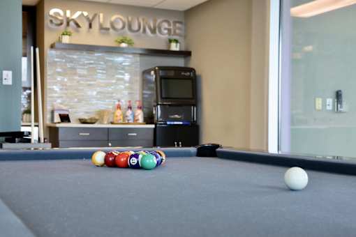 Enjoy a game of pool in our Sky Lounge rooftop amenity.
