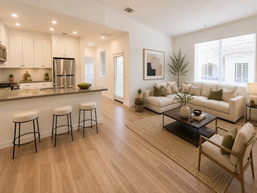 A modern kitchen with white cabinets and a large island.