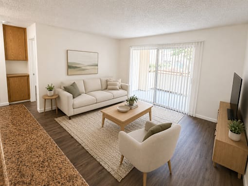 A living room with a white couch, a brown rug, and a painting on the wall.