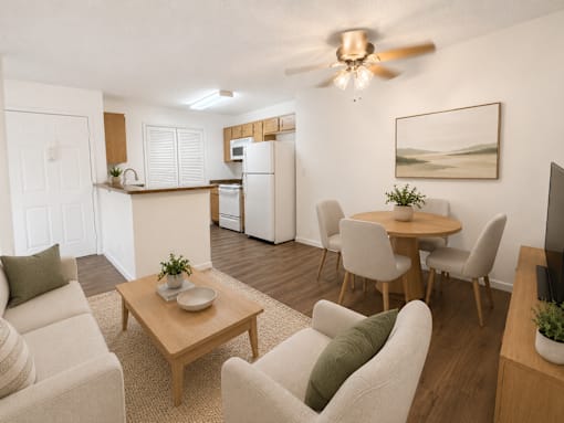 A living room with a dining table and chairs.