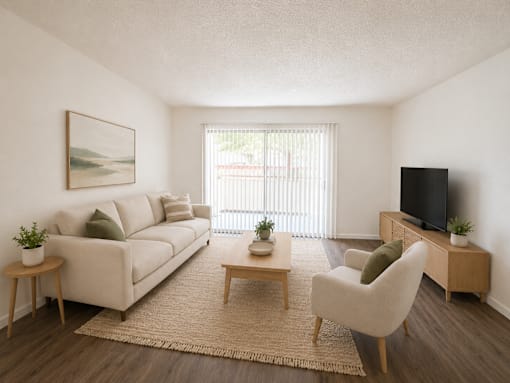 A living room with a couch, chair, and television.