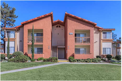 an apartment building with a sidewalk in front of it at Riverview Springs, Oceanside, CA,92058