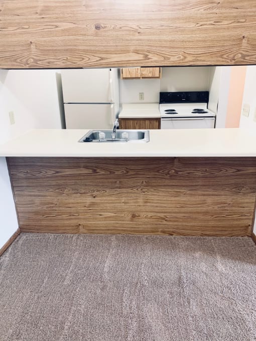 a view of the kitchen of our two bedroom apartment at university gardens