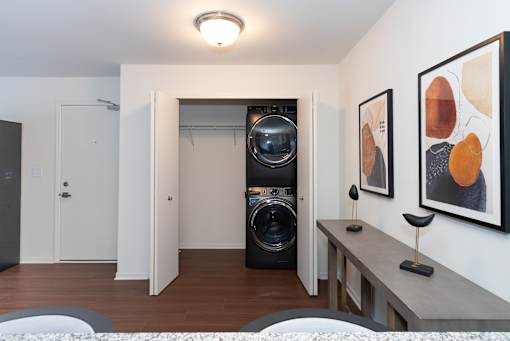 A room with a washing machine and dryer in it.