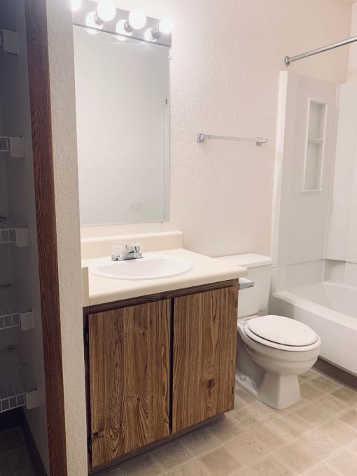 a small bathroom with a sink toilet and shower
