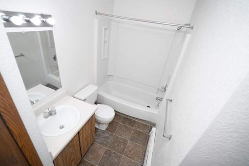 a bathroom with a sink toilet and a shower