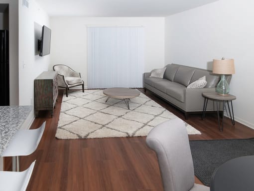 Living Room with Plank Flooring at Gray Estates Apartments, MRD Conventional, St Clair MI 48079
