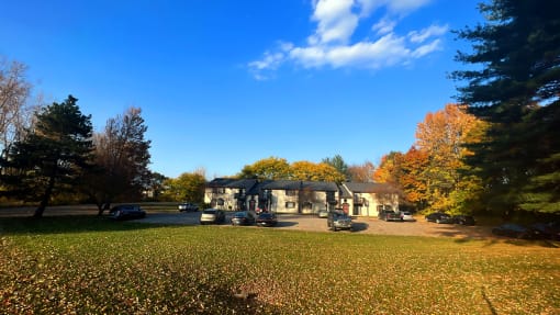 a house with a carport and a lawn in front of it