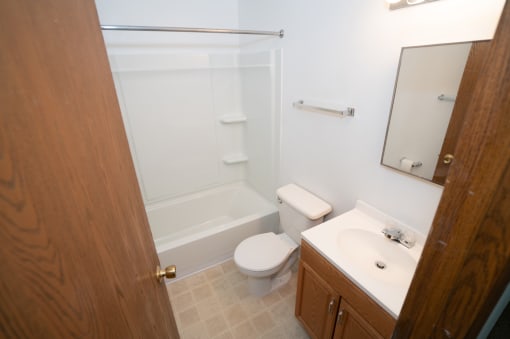 a small bathroom with a sink toilet and shower