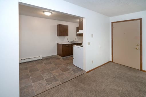 a kitchen with a stove and a sink in a small room