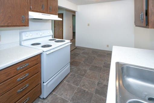 a kitchen with a stove and a sink
