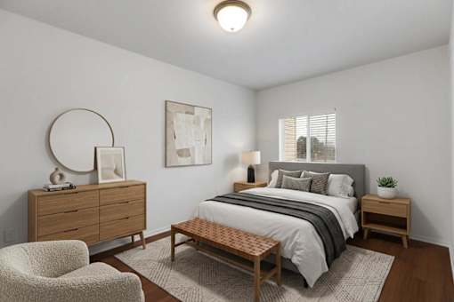 A bedroom with a bed, nightstand, and chair.