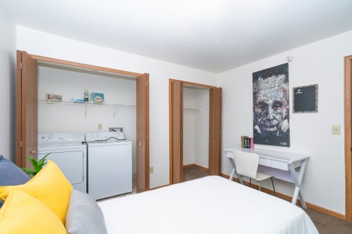 Bedroom with bed and work station at Martin Estates Apartments, Shelbyville, IN, 46176
