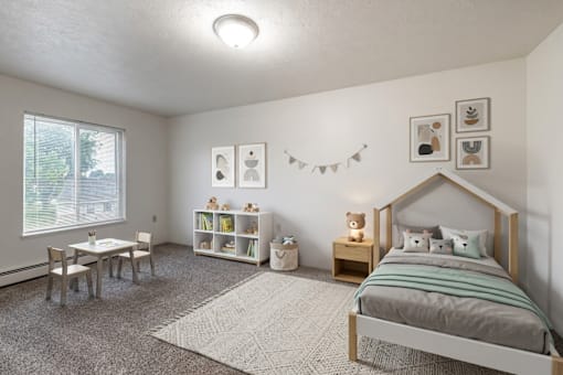 A bedroom with a bed, a table and chairs, and a window.
