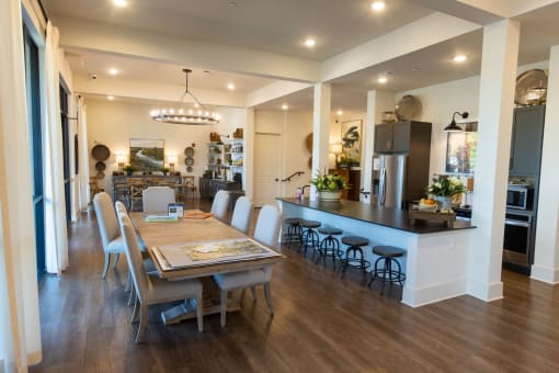 a kitchen and dining room with a table and chairs
