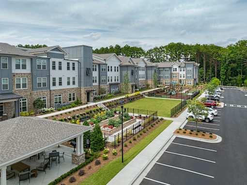 A large building with a parking lot in front of it.