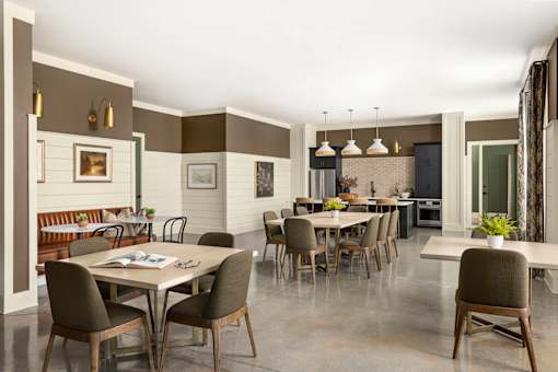 A dining room with a table set for six.