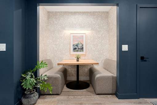 A room with a table and two chairs.