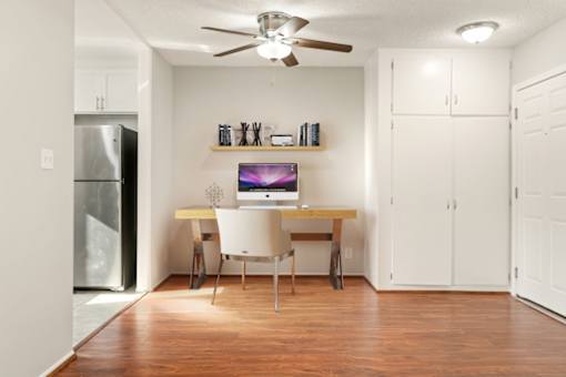 A room with a desk and a chair.