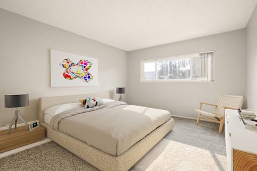 A bedroom with a large bed, a chair, and a painting on the wall.