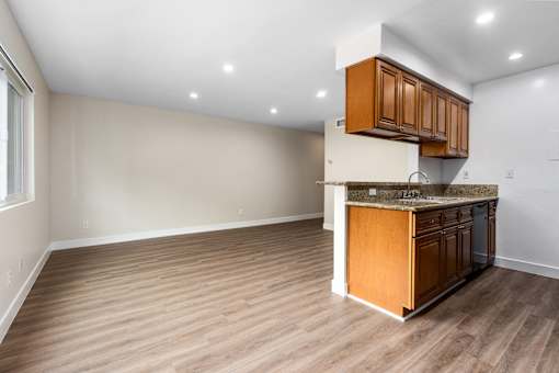 A kitchen with wooden cabinets and a countertop.
