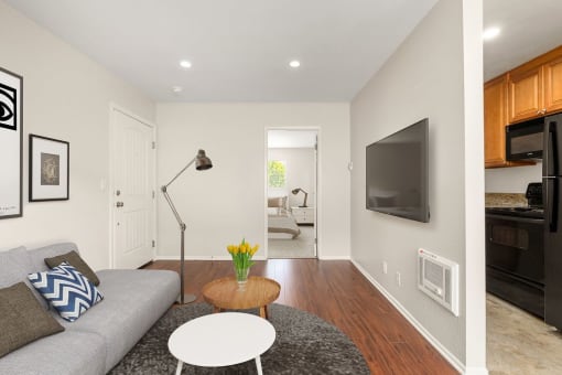 Apartments for Rent in West Hills, CA - Topanga - Living Room with Wood-Style Flooring, TV, and Couch.